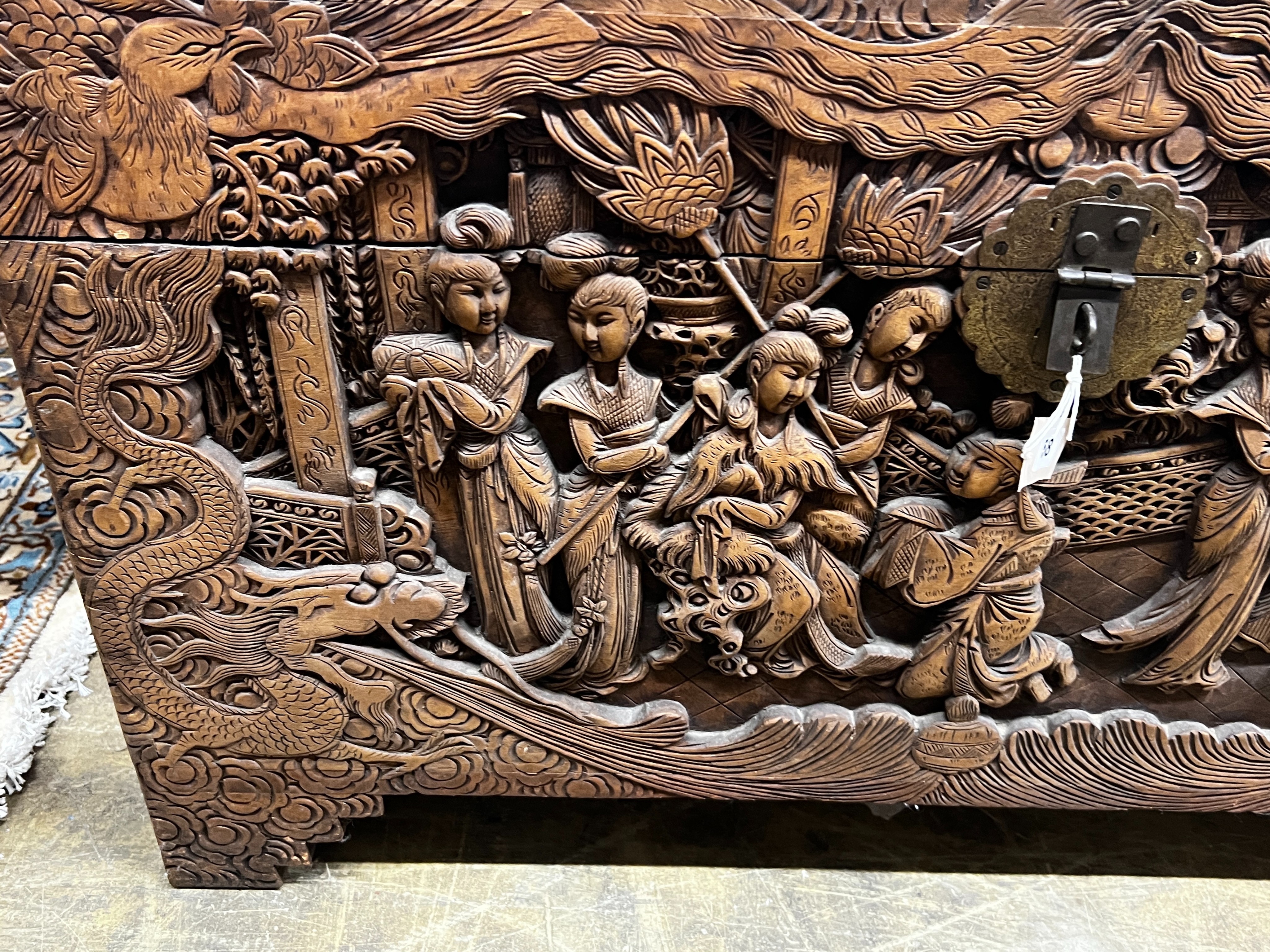 A Chinese carved camphorwood trunk, length 104cm, depth 52cm, height 61cm